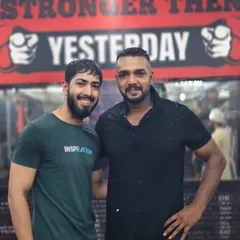 A photo with a student. The gym is a place to build yourself and form strong connections.