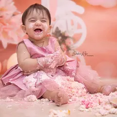 First birthdays are for making a happy mess. This cake smash session was full of laughter as she dove right into the frosting, creating a memory of pure, sweet fun.