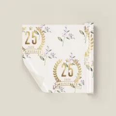 A closer view of the custom 25th anniversary gift wrap. The repeating pattern of the golden anniversary crest and soft lilac florals creates a beautiful and cohesive look for all the event's gifts.