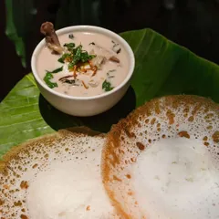 This is pure comfort food for me. My Mutton Stew is rich and fragrant, cooked with potatoes and carrots in a creamy coconut milk base. It’s best enjoyed with my soft, lacey appams, which I make fresh for every order using a batter that I have to babysit just right.
