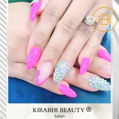 This set combines hot pink nails with accent nails completely covered in iridescent rhinestones. It's the ultimate glamorous and eye-catching manicure.