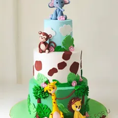 I brought the jungle to life with this three-tiered fondant cake for a child's birthday. It features handcrafted, edible animal figures like a lion, giraffe, monkey, and elephant, all set in a vibrant, leafy green landscape. Each tier tells a part of the story, making it an exciting centerpiece for any kids' party.