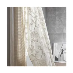 The 'Trafalgar' collection offers a wide range of sheer fabrics, from contemporary to classic styles. This floral embroidered sheer adds a touch of elegance and texture to the window, softening the light and the room's edges.