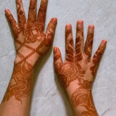 The beautiful, warm reddish-brown stain of two different designs after the color has fully matured. This is the rich, long-lasting color you can expect from my natural henna.