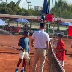 Our player Aarav Chhallani in discussion with the team coach during a changeover at the ATF U-12 team event.