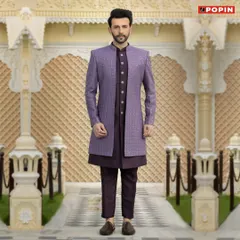 For a look that is both royal and modern, I recommend a Jodhpuri suit like this one. This particular piece features a textured purple bandhgala jacket over a matching dark kurta and trousers, creating a sharp, layered silhouette perfect for a reception or sangeet.