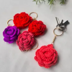 A bouquet of my crochet rose keyrings in vibrant shades of red, pink, and purple. They are a great way to add a floral touch to your accessories.