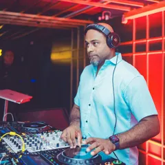A clear shot of me at the Pioneer DJ decks at Gawky Goose, focused on mixing the perfect weekend soundtrack.