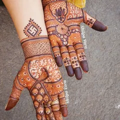 A classic design combining a graceful peacock on one hand with a lotus and swastika motif on the other, perfect for any festive occasion.