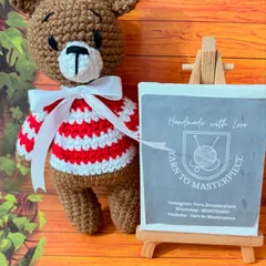 This little bear is all dressed up for the holidays in his red and white striped sweater. He’s a perfect festive decoration or a cuddly Christmas gift for a loved one.
