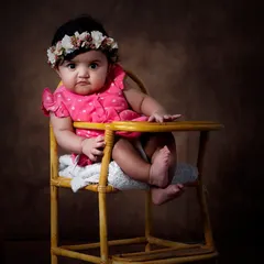My studio sessions offer a timeless, fine art look. The dramatic lighting and simple prop create a stunning, classic baby portrait.