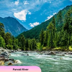 The beautiful Parvati River flowing through the valley near Kasol. Our caravan allows you to park and enjoy such serene natural spots.