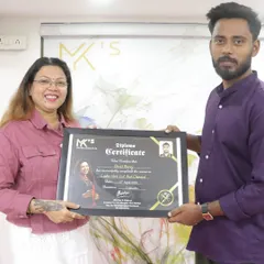 Another successful student receiving his diploma for the Ladies Hair Cut and Chemical course. My academy is dedicated to providing quality training for a career in beauty.
