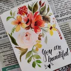 A hand-painted floral card with the calligraphy message "You are beautiful." These cards are perfect for birthdays, thank you notes, or just to brighten someone's day.