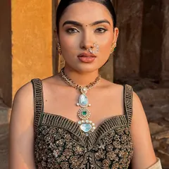 A modern and elegant look featuring a subtle application with a hint of colored kajal. This makeup speaks of elegance and enhances natural beauty.