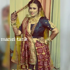 A happy bride in her beautiful Panetar saree. I gave her a classic bridal makeup look with a pearl-lined hairstyle to match her traditional Gujarati wedding attire.