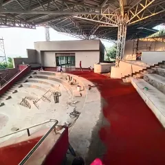 We worked with local artisans to revive the craft of red oxide flooring at the TAPMI Centre. This image captures the meticulous, hands-on process of applying the red oxide, creating a vibrant, seamless surface for the community amphitheater.