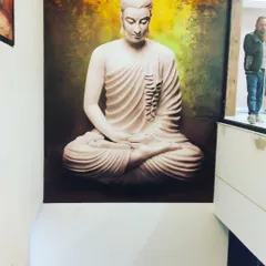 A large, custom printed wallpaper mural of a meditating Buddha. I can take any high resolution image and turn it into a seamless wall covering for a peaceful and personalized space.
