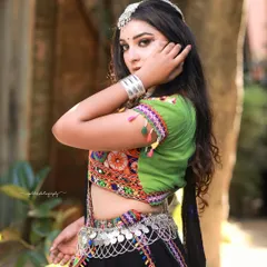 A stylish pose from the Navratri shoot, highlighting the colorful embroidery and mirror work of the chaniya choli.