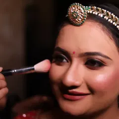A light dusting of blush adds a healthy, natural-looking flush to the cheeks. This is a key step for creating a fresh and youthful bridal glow.