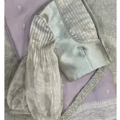 Another view of our silver blouse with pleated organza sleeves, a design that is anything but average.