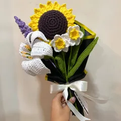 We love mixing and matching flowers to create your perfect bouquet. This custom piece combines a bright sunflower, a classic white lily, delicate daffodils, and a sprig of lavender for a truly unique arrangement.