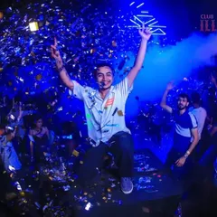 Jumping high above the crowd during a confetti blast at Club Illusions. This fisheye shot captures the explosive energy and celebration of a signature #teamnelson night.