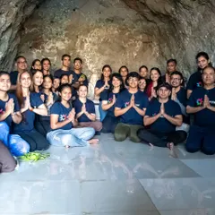 A group of seekers meditating together inside a natural cave. These unique sessions allow for deep introspection, free from the distractions of the outside world, connecting us to ancient yogic traditions.