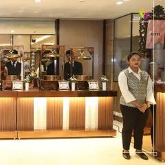 Another shot of our professional service staff, ensuring the 'Roti' station is perfectly managed and guests are served efficiently.