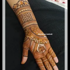 A single-hand design for a guest, featuring a hanging bell motif within the palm. This is a great example of a lighter pattern that is still rich in detail.