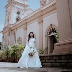 A beautiful Christian bride standing outside the church, ready to walk down the aisle. I focus on capturing the elegance and anticipation of this pivotal moment.