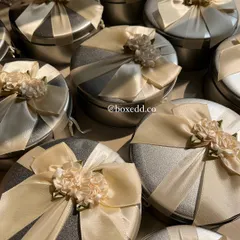 A closer look at the sophisticated ribbon work on these silver tin boxes, designed as return favours for a special event.