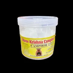 Our Shree Krishna Camphor comes in a securely sealed tub to maintain its freshness and strong, purifying scent. This image shows the product against a clean black background, highlighting the pure camphor crystals inside.