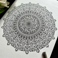 There is a timeless elegance to classic black and white. This large A3 mandala showcases the beauty of intricate linework and detailed patterns, creating a sophisticated and meditative piece that adds a touch of 'Saadgi' or simplicity to your decor.