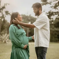 A tender moment between the parents to be. His gentle touch as he frames her face shows so much love and admiration in this beautiful outdoor portrait.