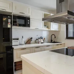 The same modern kitchen as image 5, shown from a slightly different angle.