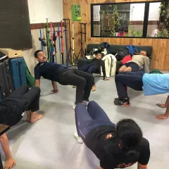 Core strengthening exercises in progress at our academy. A strong core is essential for maintaining a stable shooting stance for extended periods.