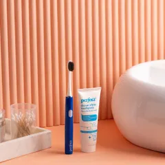 We create custom sets to match a product's aesthetic. This bathroom scene for an oral care brand uses a fluted peach backdrop and marble props to create a warm, modern feel.