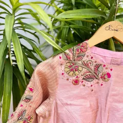 This Kalamkari patchwork blouse is a collaboration of Indian textile art and hand embroidery. We've used the fabric on the sleeves and added delicate floral embroidery.