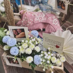 A close-up on the personalized details, including handwritten notes and photographs, that make a milestone gift truly unforgettable.