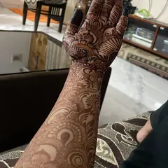 A full-arm design for a client attending her brother's engagement. The stain is still developing here, but the intricate patterns are already making a statement.