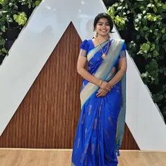 A simple and elegant look for a daytime traditional event. The makeup is fresh and minimal, paired with a classic blue silk saree and simple gold jewellery.