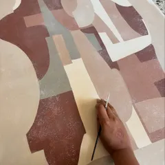 My hand at work on a large abstract piece. The process is intuitive, with my hands following the flow of the paint, letting the shapes and colors find their own conversation on the canvas.