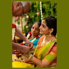 A precious moment from the Varapooje ceremony. The makeup was designed to look soft and beautiful from every angle, even in candid moments like this one.