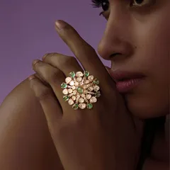 This statement Polki ring is designed to turn every gesture into grace. The floral bloom design features uncut polkis and bright emeralds, creating a piece that is both bold and beautiful.