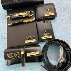 A complete, coordinated gift set in classic black. This hamper features a personalized temperature bottle, diary, pen, wallet, card holder, eyewear case, keychain, and a belt, all customized with his name and choice of charm.