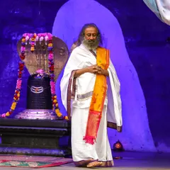 I am standing in front of the Shiva Lingam at our ashram temple during a Rudra Puja. This powerful ceremony is a cornerstone of our weekly offerings, open for all to attend.