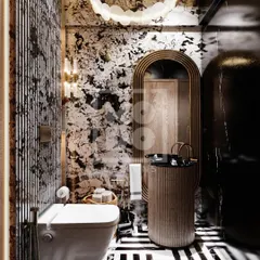 Bold and artistic, this powder room features striking black-and-white patterned marble and geometric floor tiles. The unique light fixture and fluted pedestal sink make it a memorable design statement.