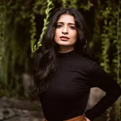 A smart and elegant portrait where the makeup is clean and sophisticated. A defined brow, soft contour, and a deep nude lip create a polished and professional look.