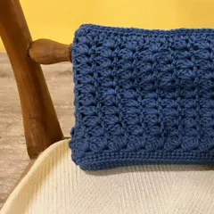 A closer look at the beautiful tulip stitch on the upcycled clutch. This texture gives the bag a completely new and modern feel, making it a statement accessory you'll love to carry.
